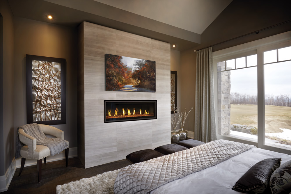 Napoleon Vector LV50-2 installed in contemporary bedroom with DHC and a painting above the fireplace.