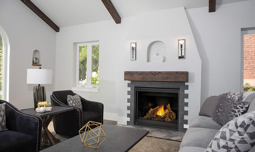 Napoleon Ascent B42 gas fireplace with rustic wood mantel above and gray notched tile along sides in white living room.