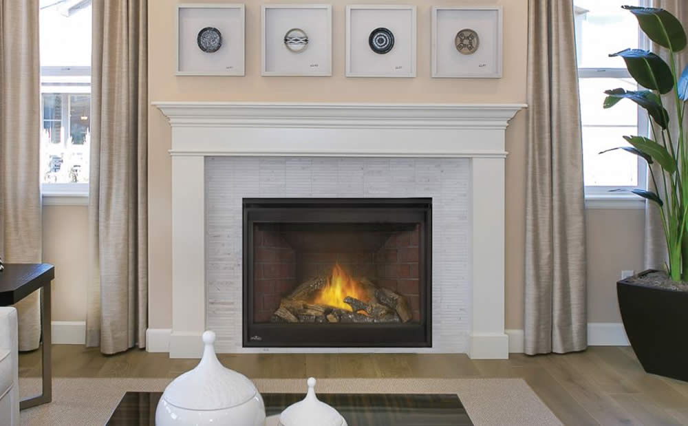 Napoleon GX42 gas fireplace shown with white tile surround and white mantel with windows on either side, this is a closeout model