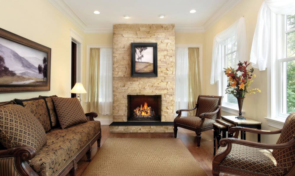 Napoleon Fiberglow vented gas logs shown in traditional living room fireplace