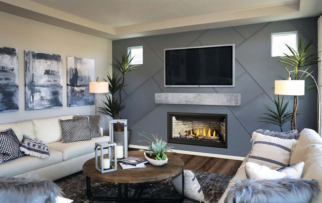 Napoleon Ascent Linear Premium 42 gas fireplace shown burning with optional ledgerock panels and driftwood on gray living room wall.