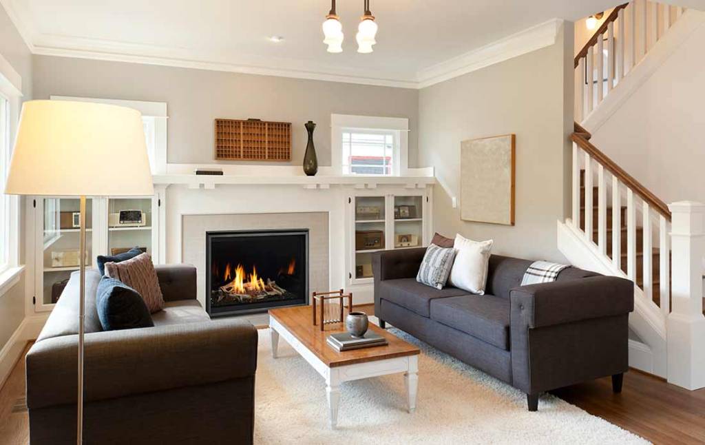 Majestic Meridian Modern gas fireplace flanked by builtin cabinetry in contemporary living room with gray sofas