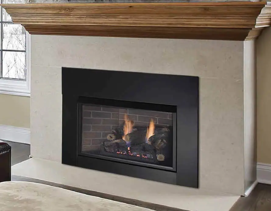 Monessen Solstice vent free gas fireplace insert with black surround in off-white tiled fireplace with traditional millwork wood stained mantel above.