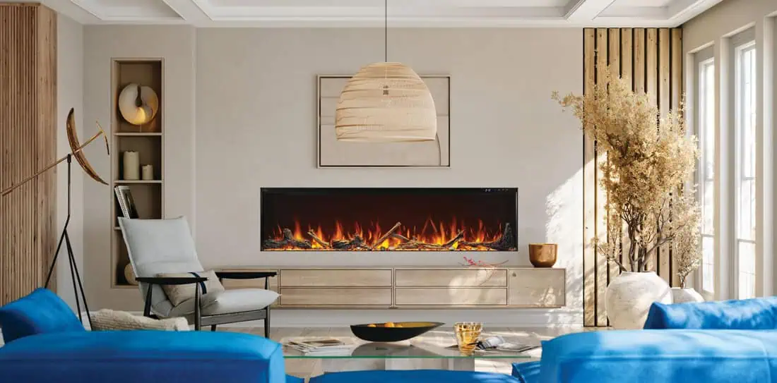 Napoleon Astound FlexMount 74" linear electric fireplace fully recessed into neutral colored living room wall, bright blue sofa in foreground