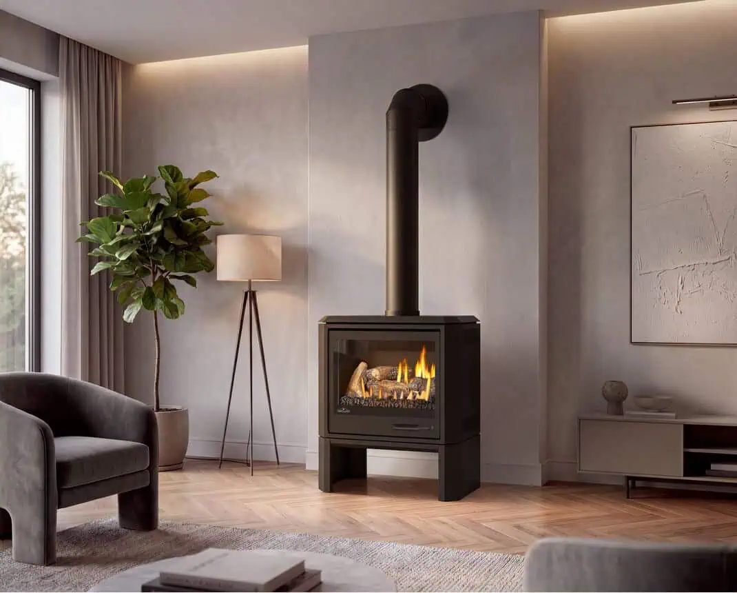 Napoleon Havelock Elite gas stove on legs in a warm neutral tone living room with plastered and stone walls, parquet wood floor, large window and fiddle leaf fig topiary to left.
